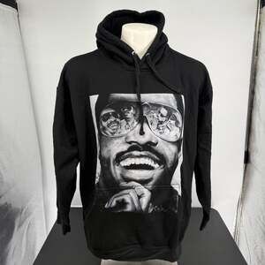 Black hoodie featuring a graphic of Stevie Wonder.